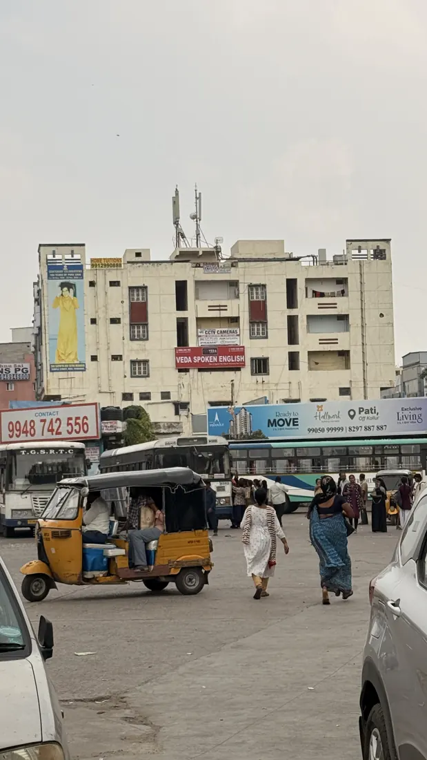 Hemadurga Sharada Galaxy building with Veda Spoken English board seen from Lingampally Bus Stop